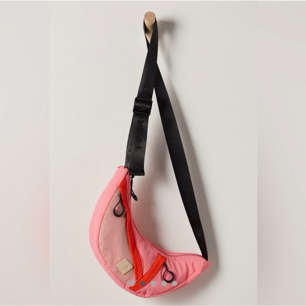 Free People FP Movement Nothing But Net Sling Bag in the color Hibiscus